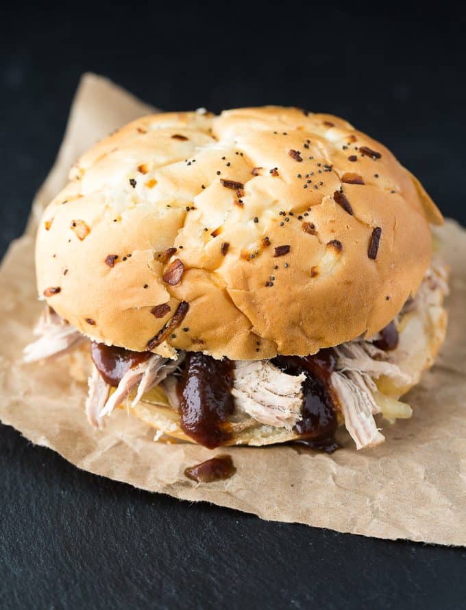 Slow Cooker Pulled Pork - You don't need a smoker for juicy pulled pork! Make this barbecue recipe in the Crockpot for sandwiches, baked potatoes, or pork tacos.