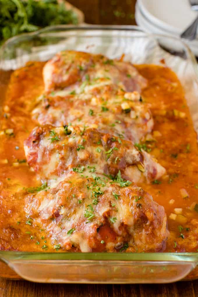 Baked chicken parmesan in a casserole dish.