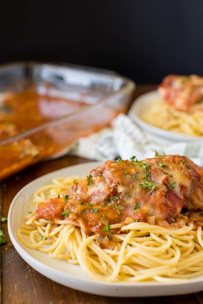 Baked Chicken Parmesan - Fast enough for a weeknight, but elegant enough for dinner parties! Serve over spaghetti or on its own.