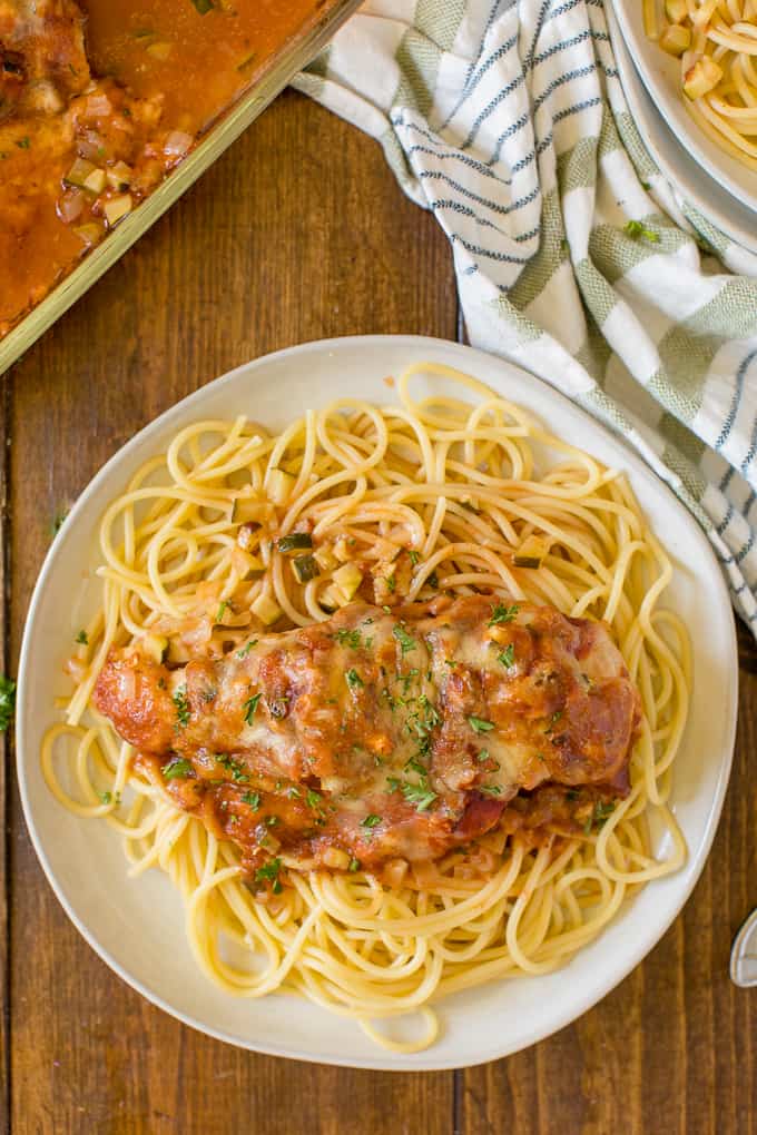 Baked Chicken Parmesan - Fast enough for a weeknight, but elegant enough for dinner parties! Serve over spaghetti or on its own.