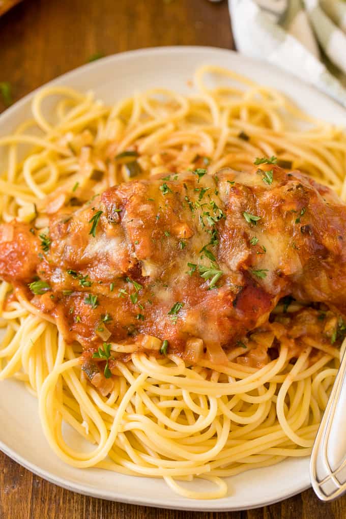 Baked Chicken Parmesan - Fast enough for a weeknight, but elegant enough for dinner parties! Serve over spaghetti or on its own.