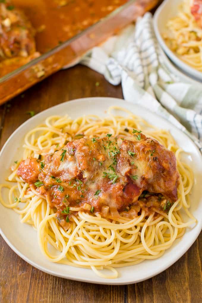 Baked Chicken Parmesan - Fast enough for a weeknight, but elegant enough for dinner parties! Serve over spaghetti or on its own.