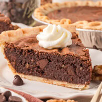 A slice of pie on a plate.