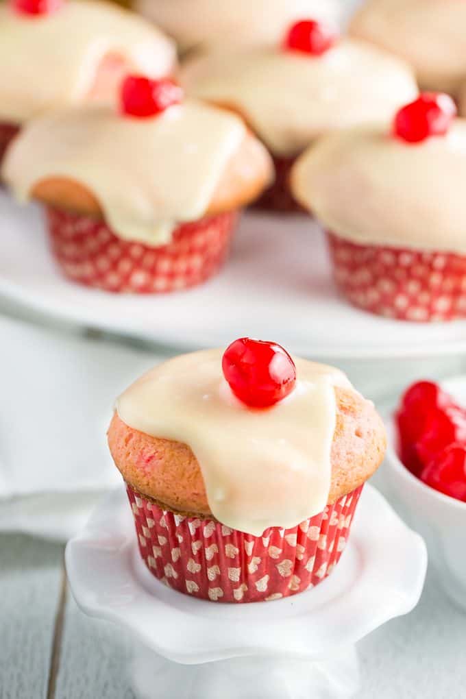 Cherry Cupcakes - White cake mix is doctored with cherries and topped with a rich, smooth white chocolate glaze.