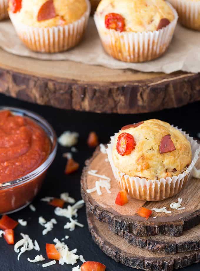 Pizza Muffins - This kid friendly snack tastes and smells like pizza, but in a muffin form. Add in your fave toppings to change it up!