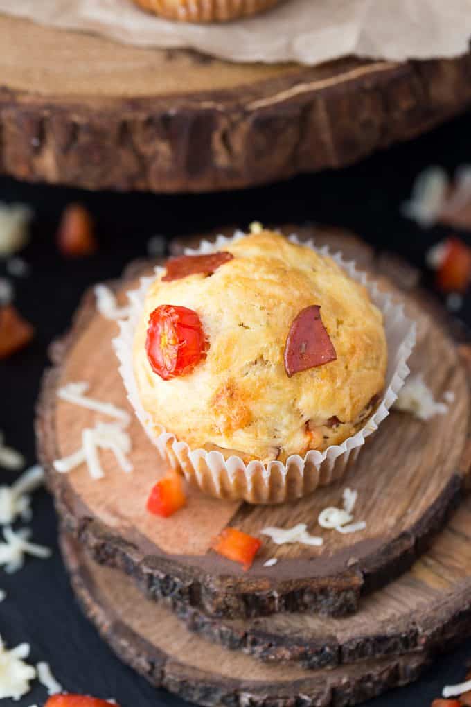 Pizza Muffins - This kid friendly snack tastes and smells like pizza, but in a muffin form. Add in your fave toppings to change it up!