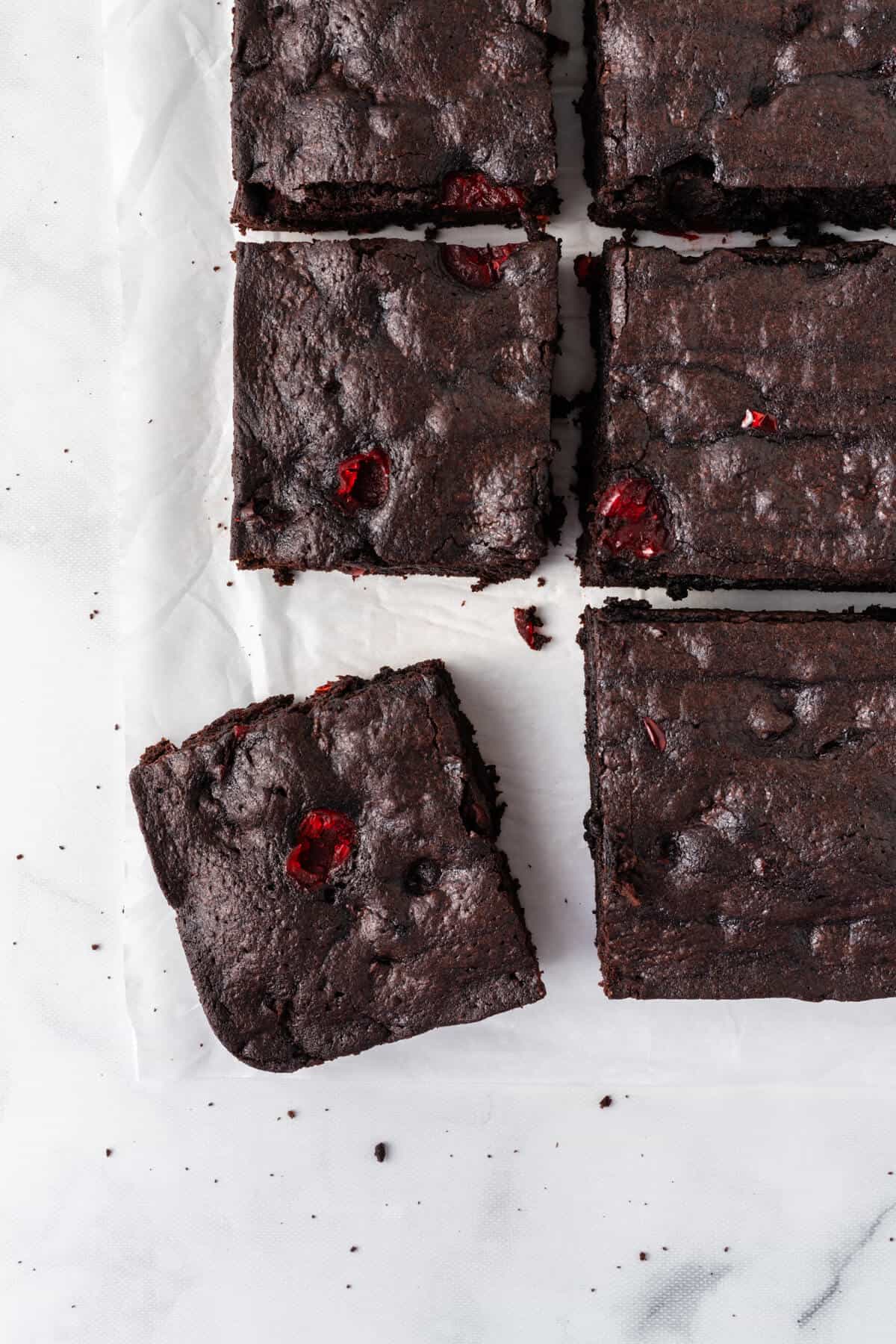 Cherry chocolate brownies cut into squares.