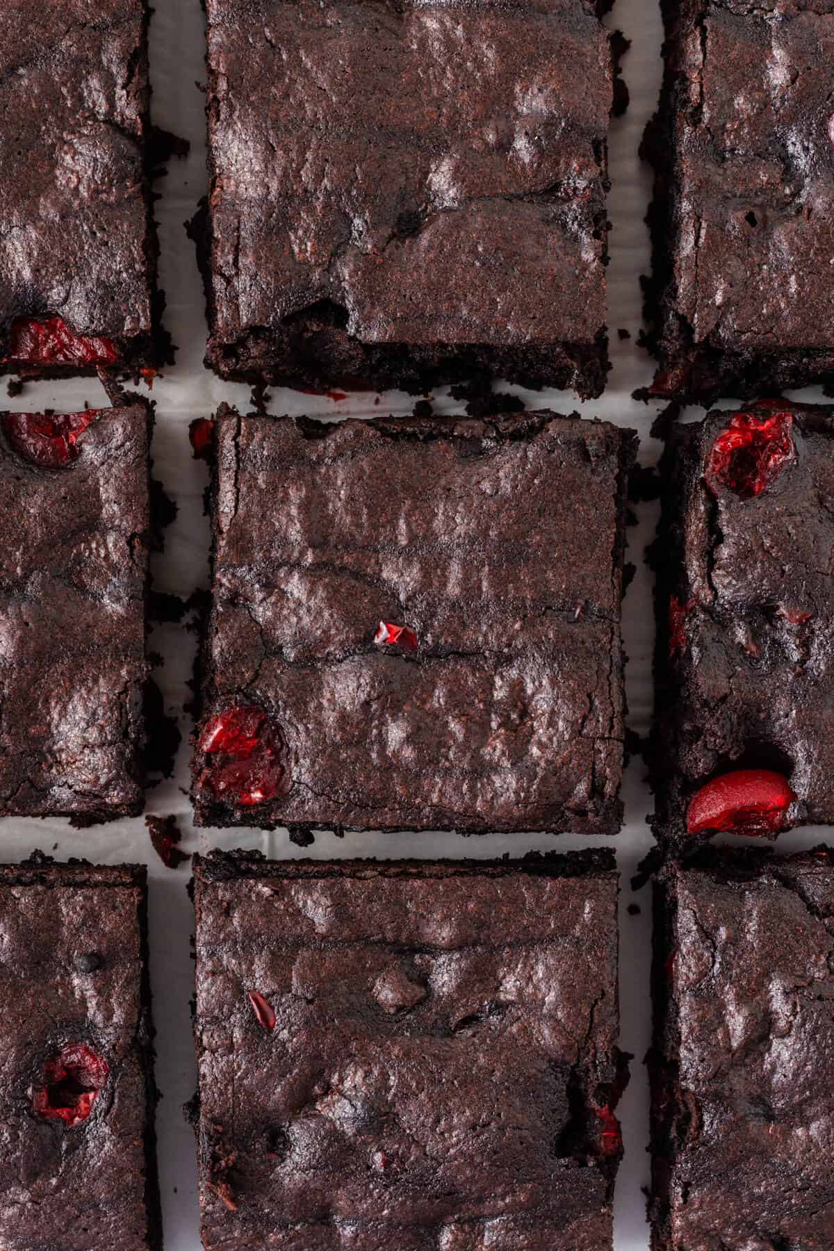 Cherry chocolate brownies cut into squares.