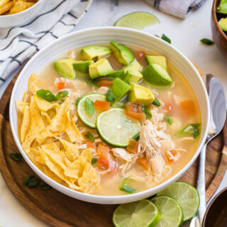 Chicken lime soup in a bowl.