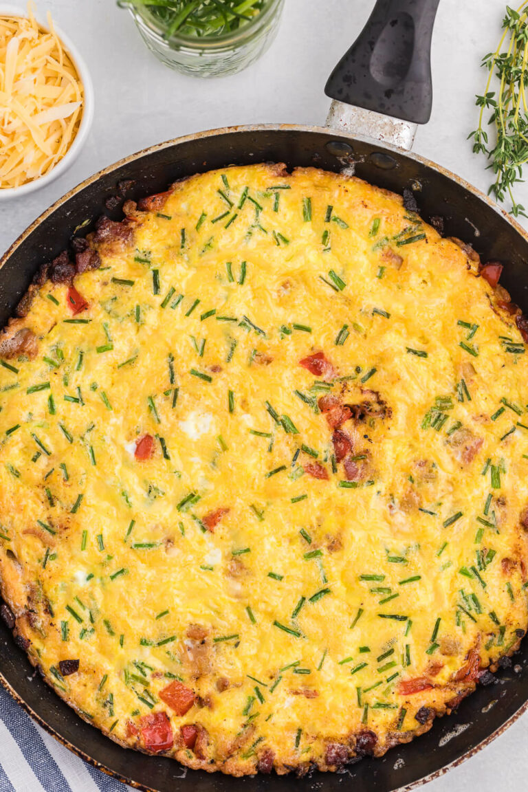 Bacon and Gouda Frittata - This breakfast/brunch recipe is a sophisticated twist on traditional bacon and eggs! Including gouda, chives and shallots, these elegant ingredients make this quick and easy meal seems like a special occasion.