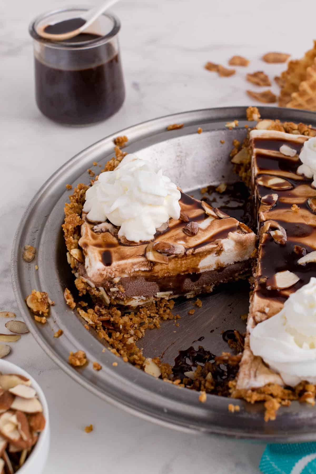 Ice cream pie in a pie pan cut in slices.