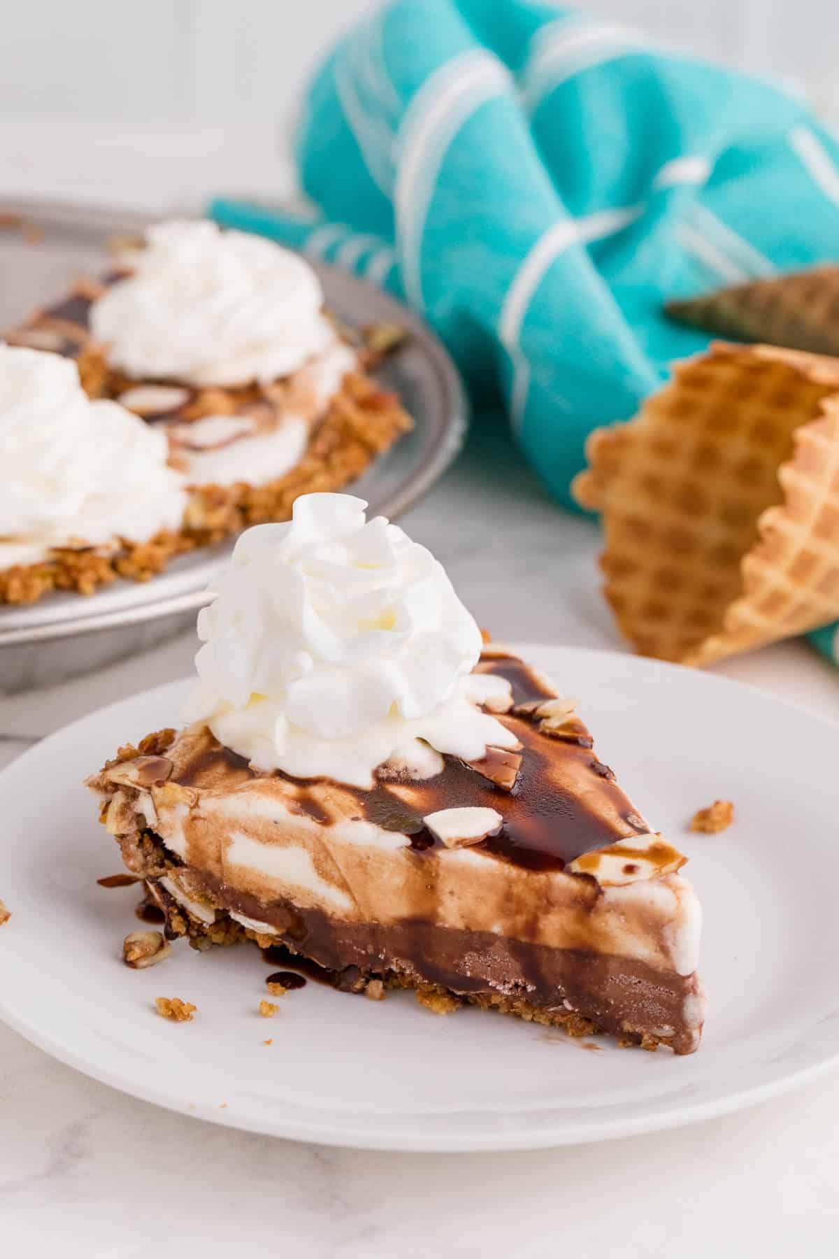 Ice cream pie slice on a plate.