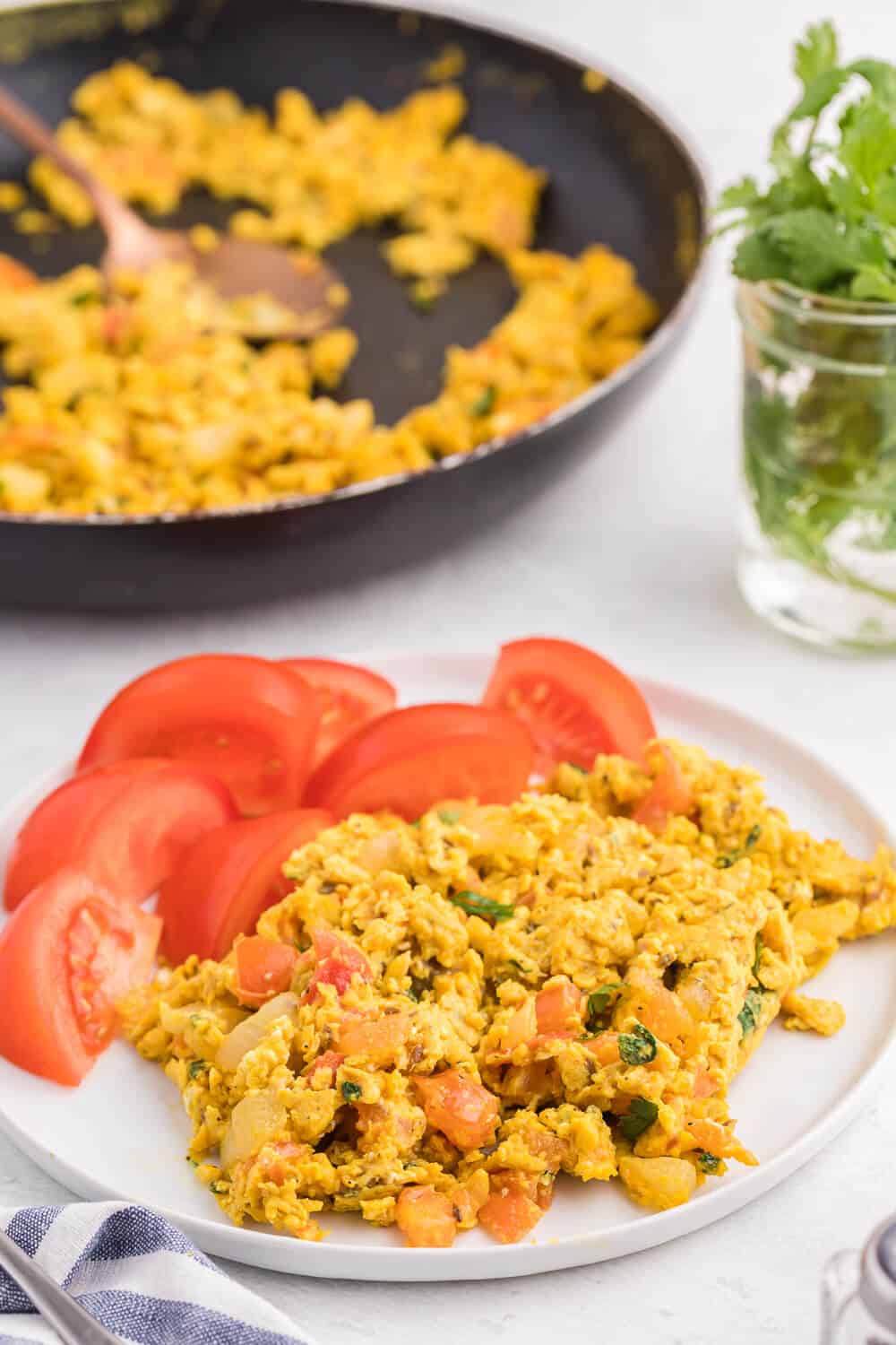 Indian Scrambled Eggs - Bring Indian seasonings to the breakfast table! This quick morning staple is packed with cumin, onion, green chiles, tomatoes, turmeric, and cilantro.