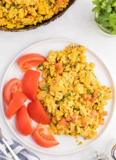 Indian Scrambled Eggs - Bring Indian seasonings to the breakfast table! This quick morning staple is packed with cumin, onion, green chiles, tomatoes, turmeric, and cilantro.