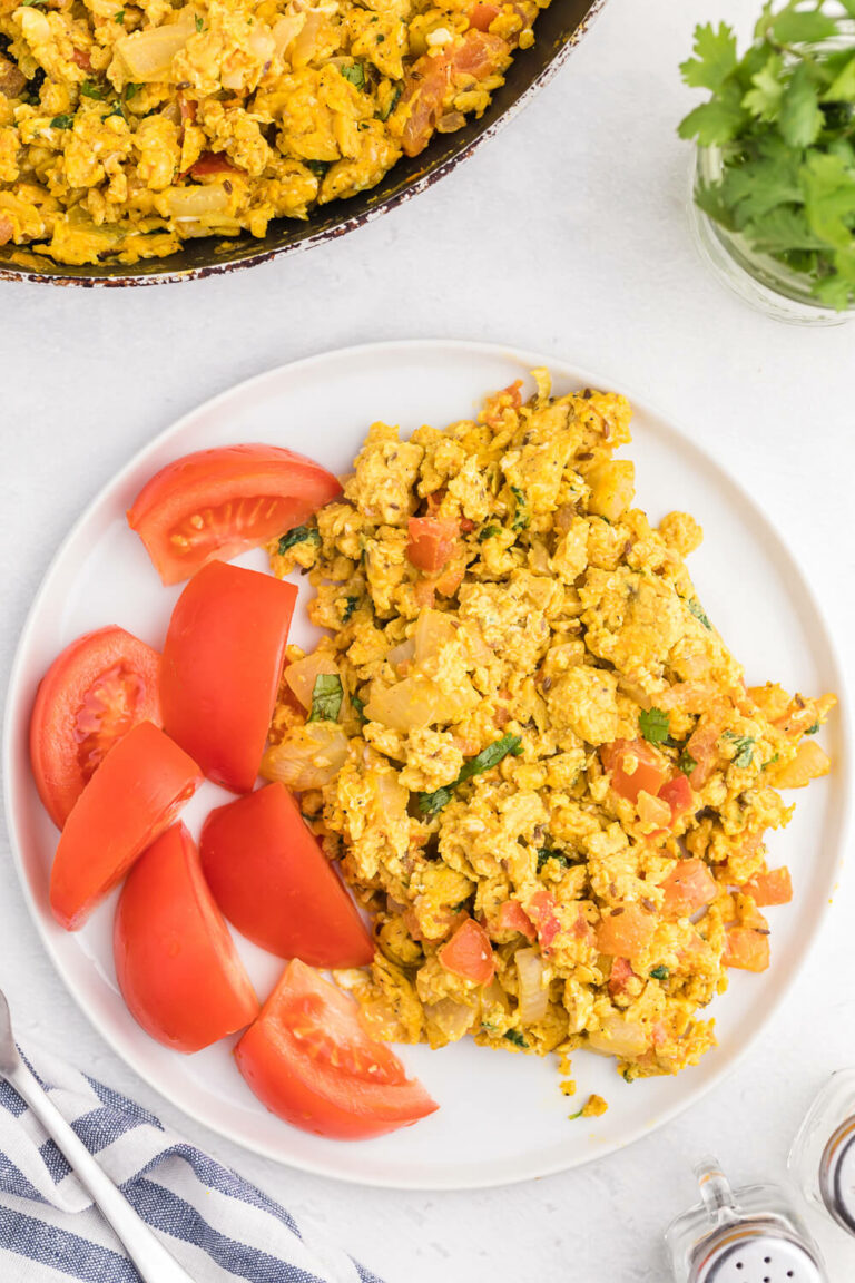 Indian Scrambled Eggs - Bring Indian seasonings to the breakfast table! This quick morning staple is packed with cumin, onion, green chiles, tomatoes, turmeric, and cilantro.