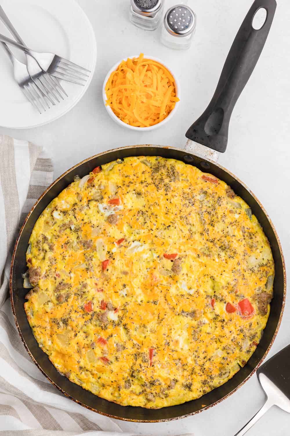 Sausage & Red Pepper Frittata - Sweet red peppers and savoury sausage are a delight together in this easy and delicious recipe. Served with a salad and fresh bread, it's the perfect quick weeknight meal!