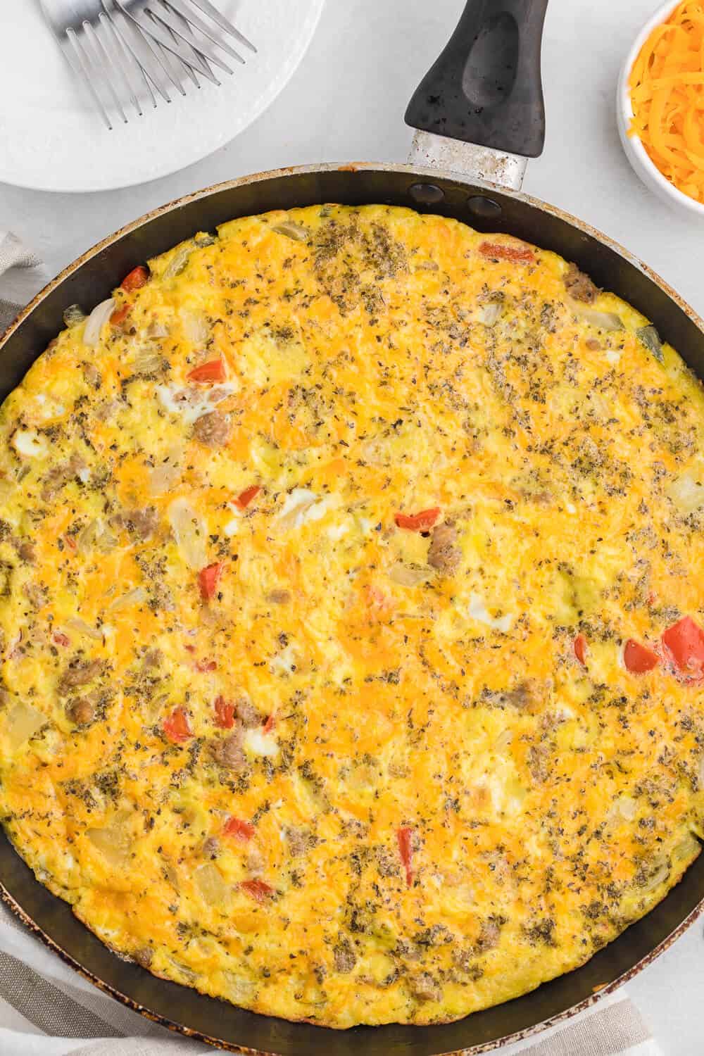 Sausage & Red Pepper Frittata - Sweet red peppers and savoury sausage are a delight together in this easy and delicious recipe. Served with a salad and fresh bread, it's the perfect quick weeknight meal!