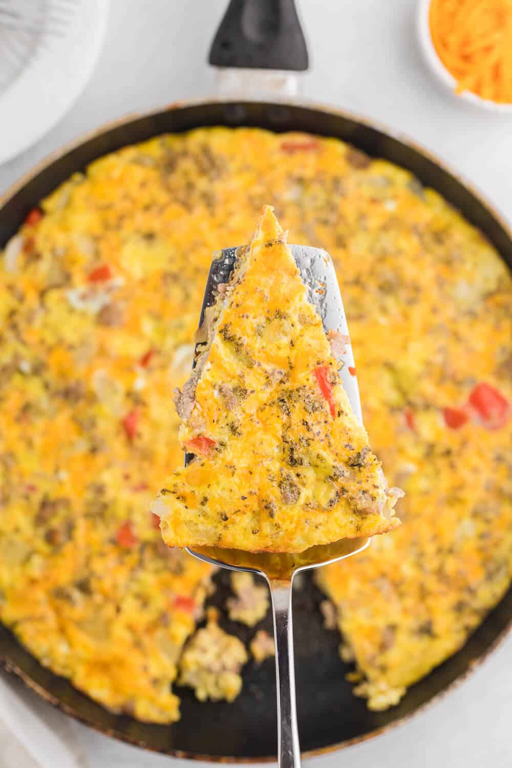 Sausage & Red Pepper Frittata - Sweet red peppers and savoury sausage are a delight together in this easy and delicious recipe. Served with a salad and fresh bread, it's the perfect quick weeknight meal!