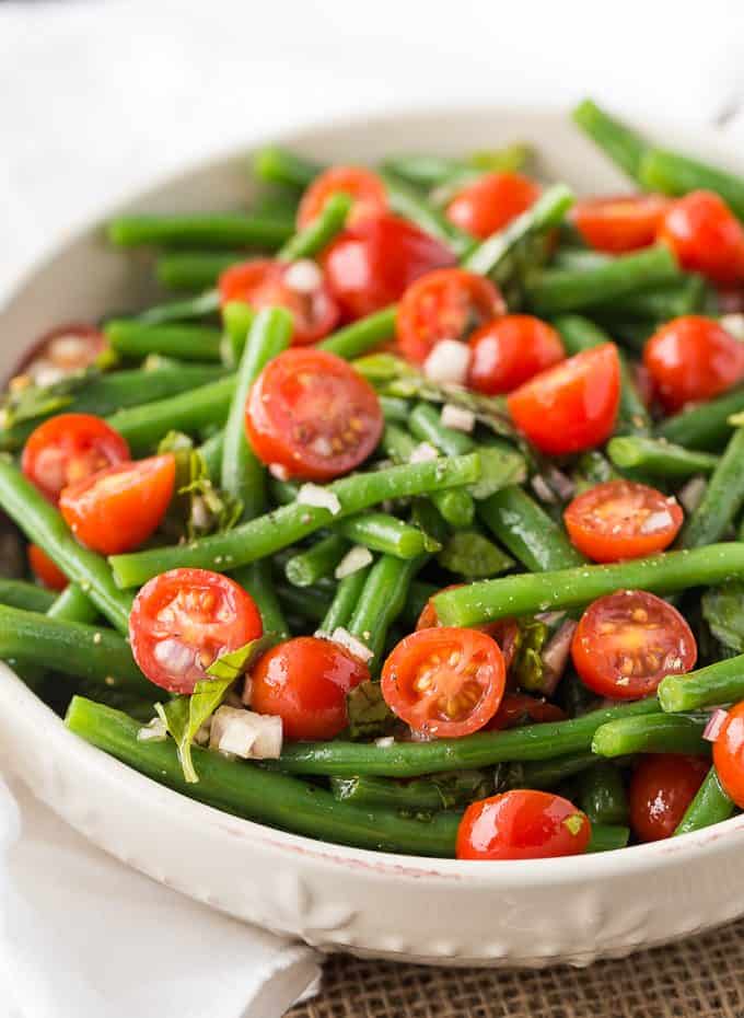 Green Bean and Tomato Salad - An effortless side dish that screams summer! This light and crispy side dish is great for weeknight dinners or your next barbecue.