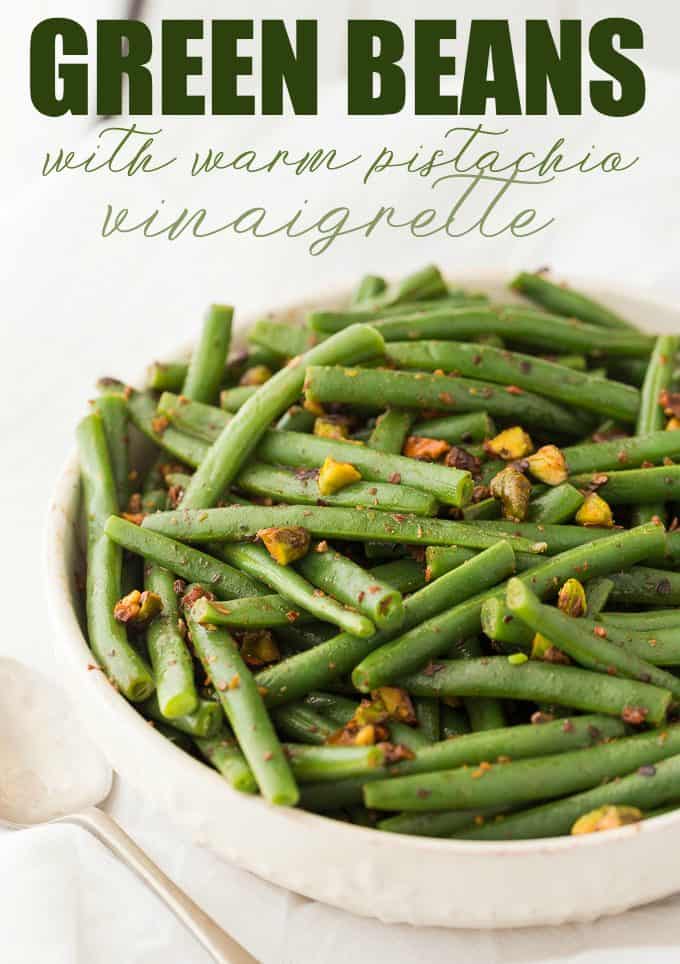 Green Beans with Warm Pistachio Vinaigrette - This recipe is as easy as it is elegant! Make these crispy green beans with a delicious red wine vinaigrette with crushed pistachios for the best holiday side dish ever.