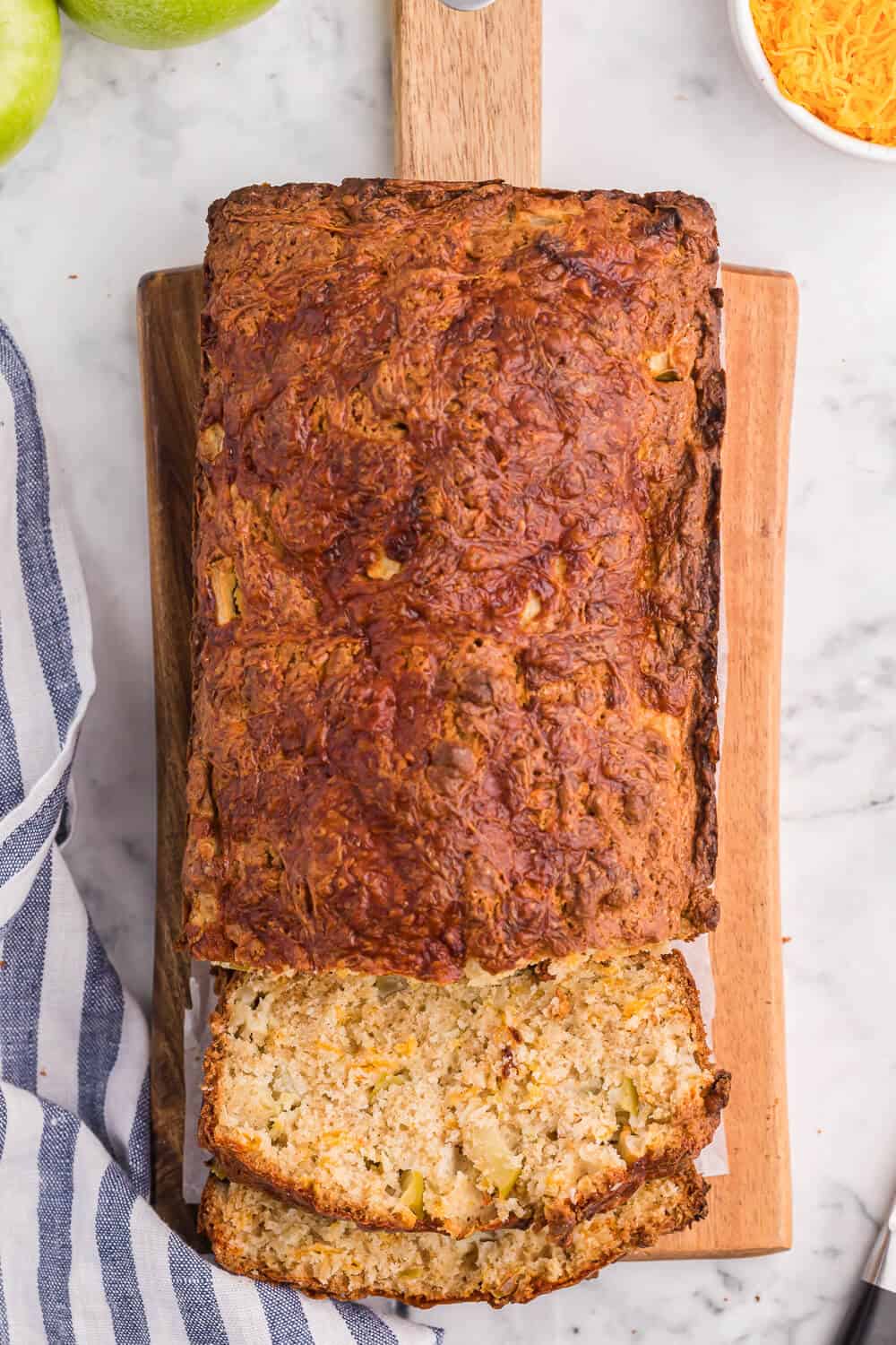 Apple cheddar bread with slices cut on the end