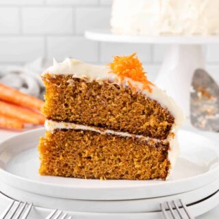 A slice of carrot cake on a plate.