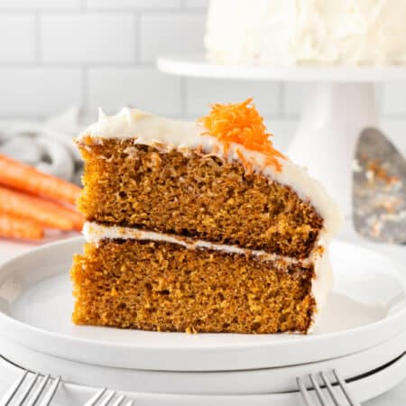 A slice of carrot cake on a plate.