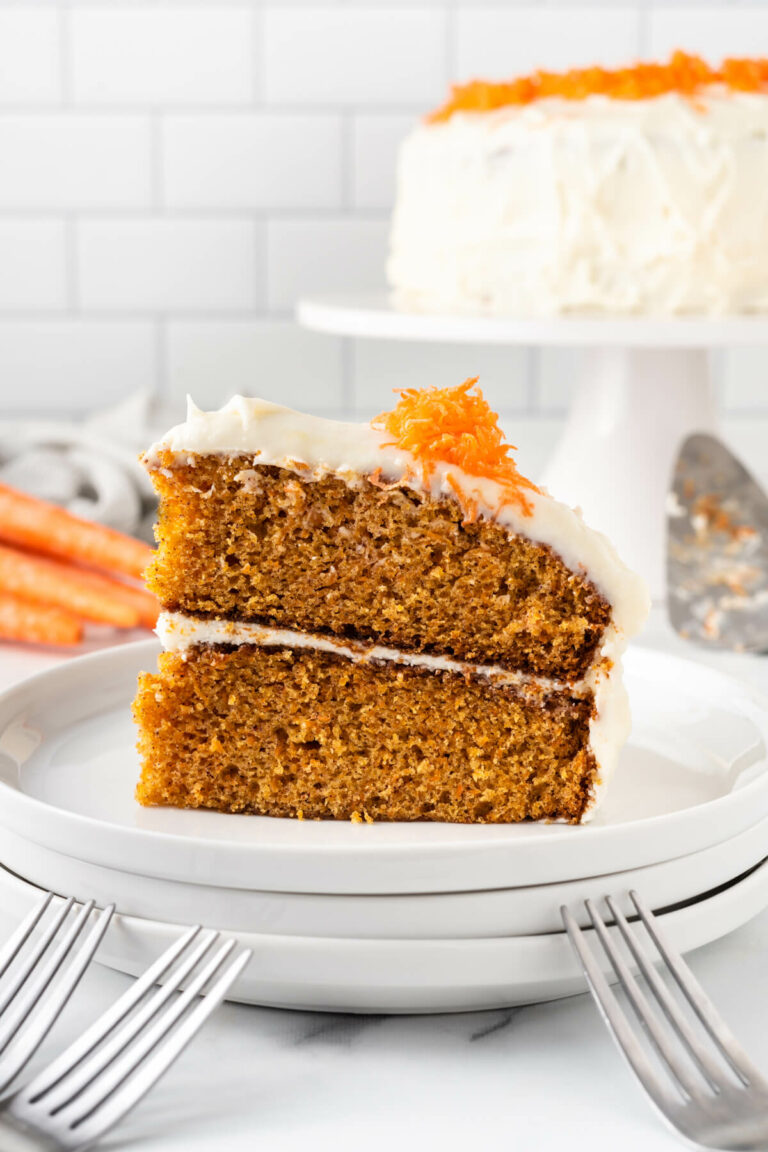 A slice of carrot cake on a plate.