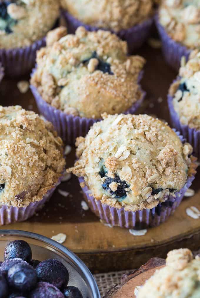 Blueberry Streusel Muffins - Cinnamon sugar topping sets these blueberry muffins apart! Packed with sweet blueberries and topped with a crunchy oat topping, these muffins are delicious fresh out of the oven with a little butter.