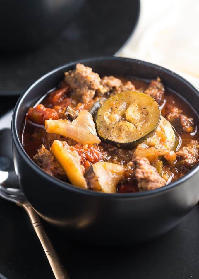 Italian Sausage and Vegetable Stew - A stick-to-your-ribs slow cooker soup! The Mediterranean vegetables blend with zucchini and Italian sausage for the heartiest stew. 