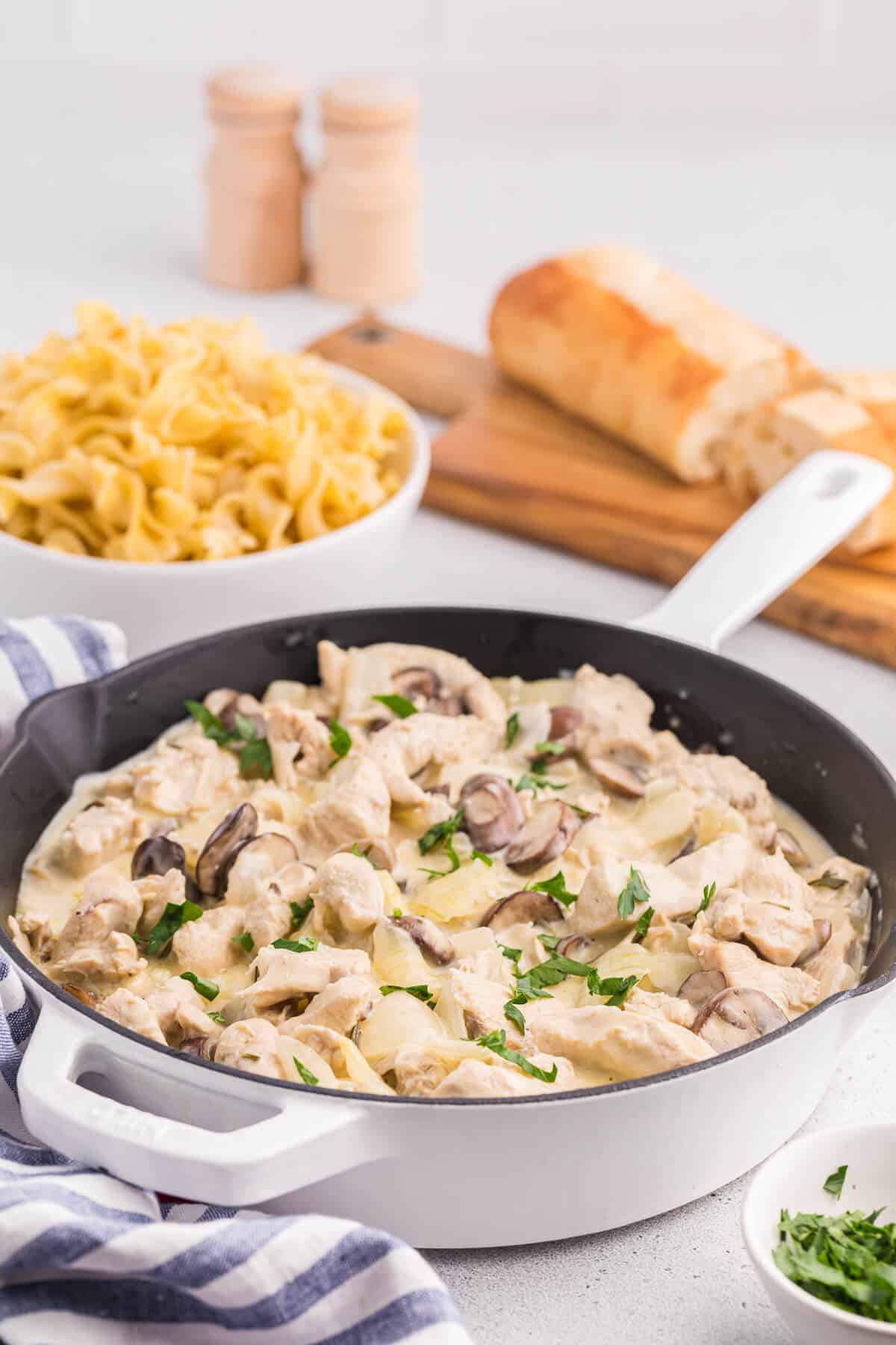 Creamy Garlic Chicken in a white skillet.