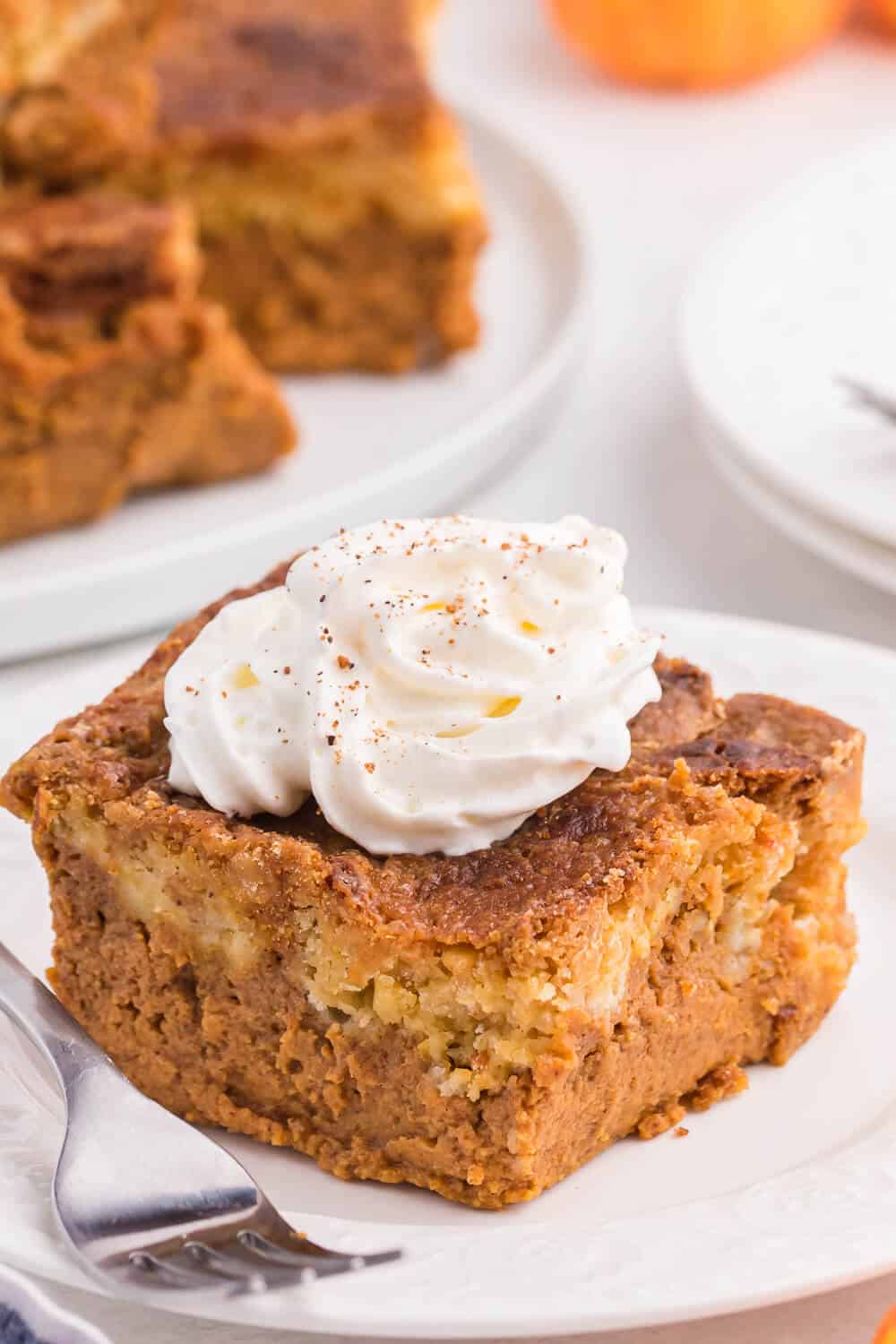 pumpkin dump cake slice on a plate