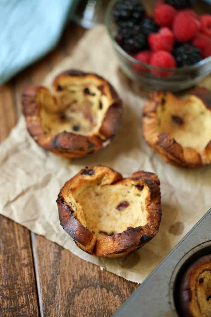 Mixed Berry Breakfast Cups - With a swirl of cinnamon and sweet raisins, these adorable little breakfast cups are begging to be filled as you wish! Try them filled with yogurt and mixed berries - yum!