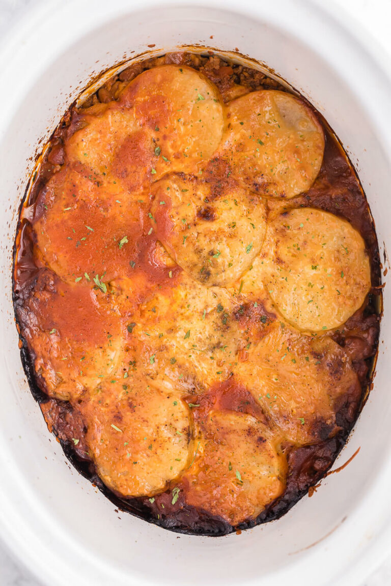 Cowboy Chicken Chili Casserole - Layers of chili, beans and potatoes for a hearty meal made in the slow cooker!