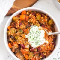 Chicken chili in a bowl with a spoon.