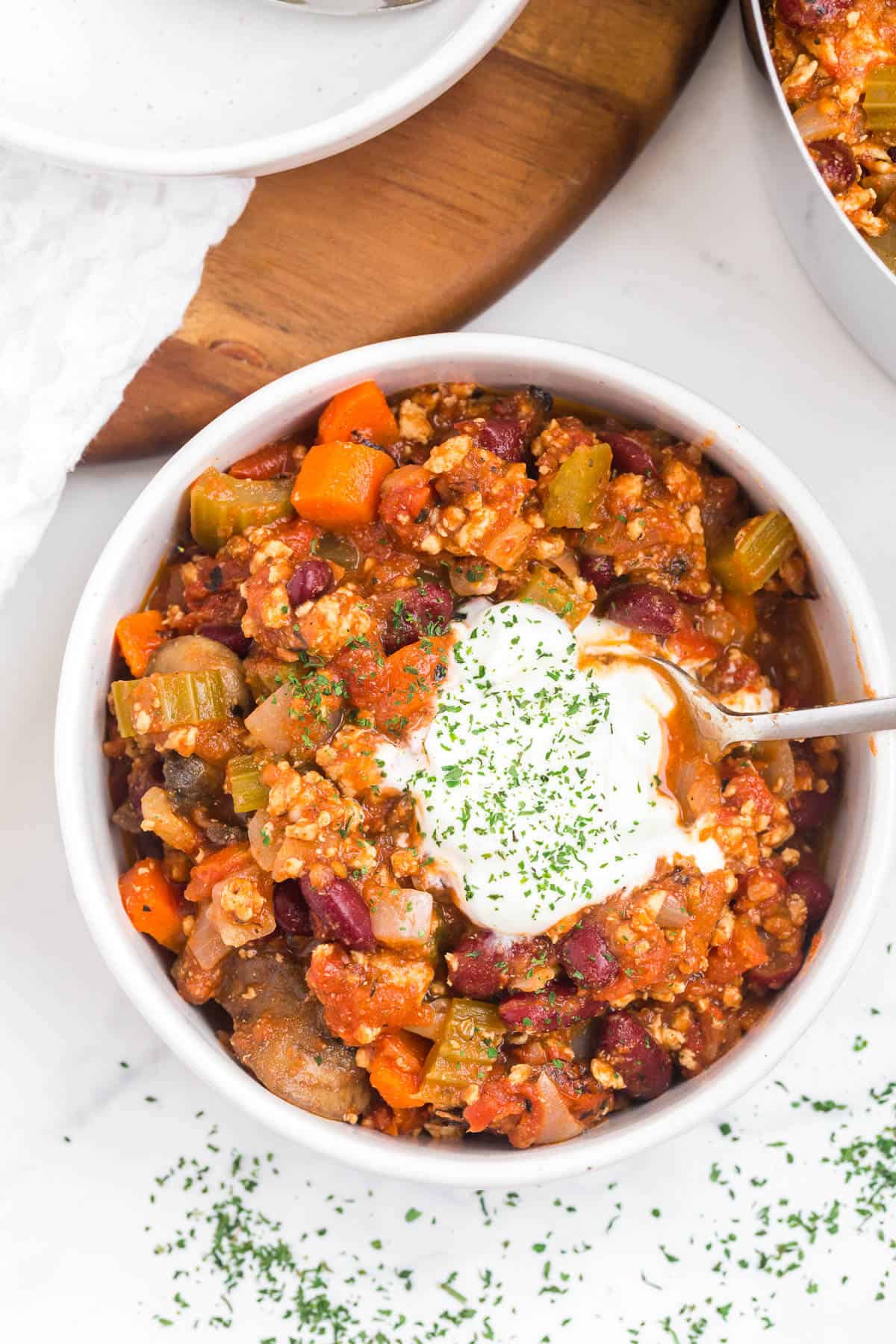 Chicken chili in a bowl with a spoon.