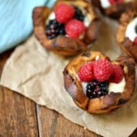 Mixed Berry Breakfast Cups - With a swirl of cinnamon and sweet raisins, these adorable little breakfast cups are begging to be filled as you wish! Try them filled with yogurt and mixed berries – yum!