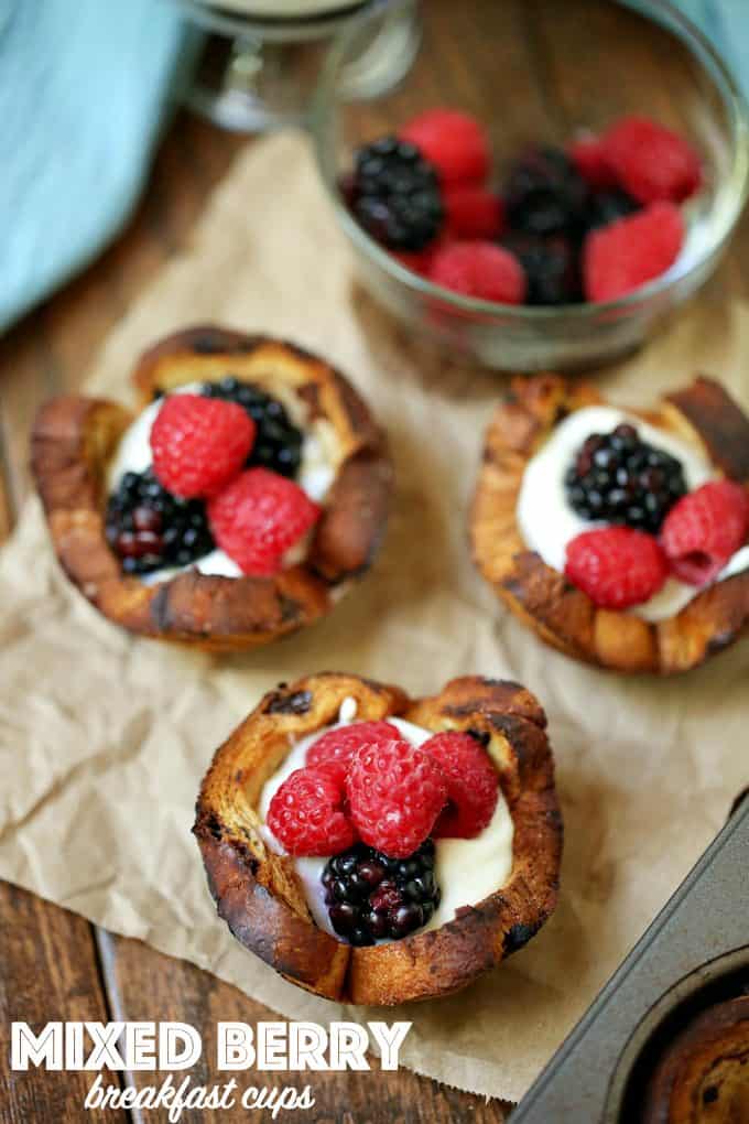 Mixed Berry Breakfast Cups - With a swirl of cinnamon and sweet raisins, these adorable little breakfast cups are begging to be filled as you wish! Try them filled with yogurt and mixed berries - yum!