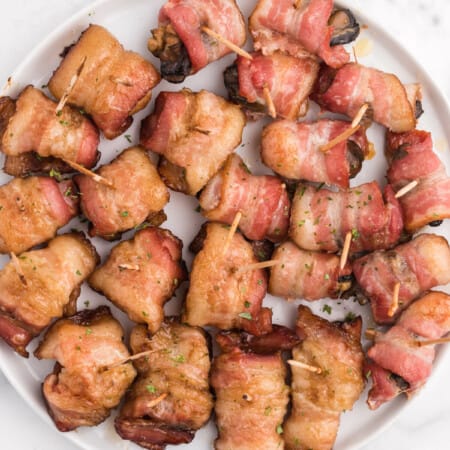 Bacon Wrapped Appetizers - Bite sized and addicting! Try four varieties - bacon wrapped water chestnuts, bacon wrapped smoked oysters, bacon wrapped pineapple and bacon wrapped olives.