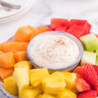 Cinnamon Cream Cheese Dip - Only four ingredients in this simple fruit dip. It's super easy to whip up and can be made the night before and kept in the fridge. Try with fruit, cookies or sweet crackers.