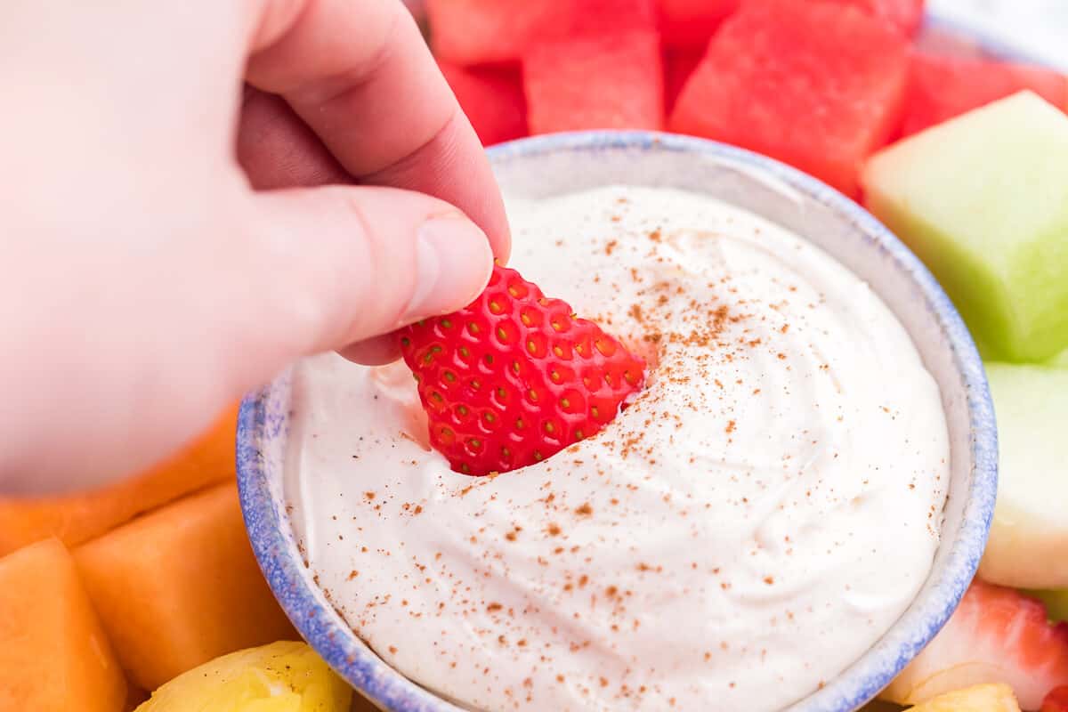 Cinnamon Cream Cheese Dip - Only four ingredients in this simple fruit dip. It's super easy to whip up and can be made the night before and kept in the fridge. Try with fruit, cookies or sweet crackers.