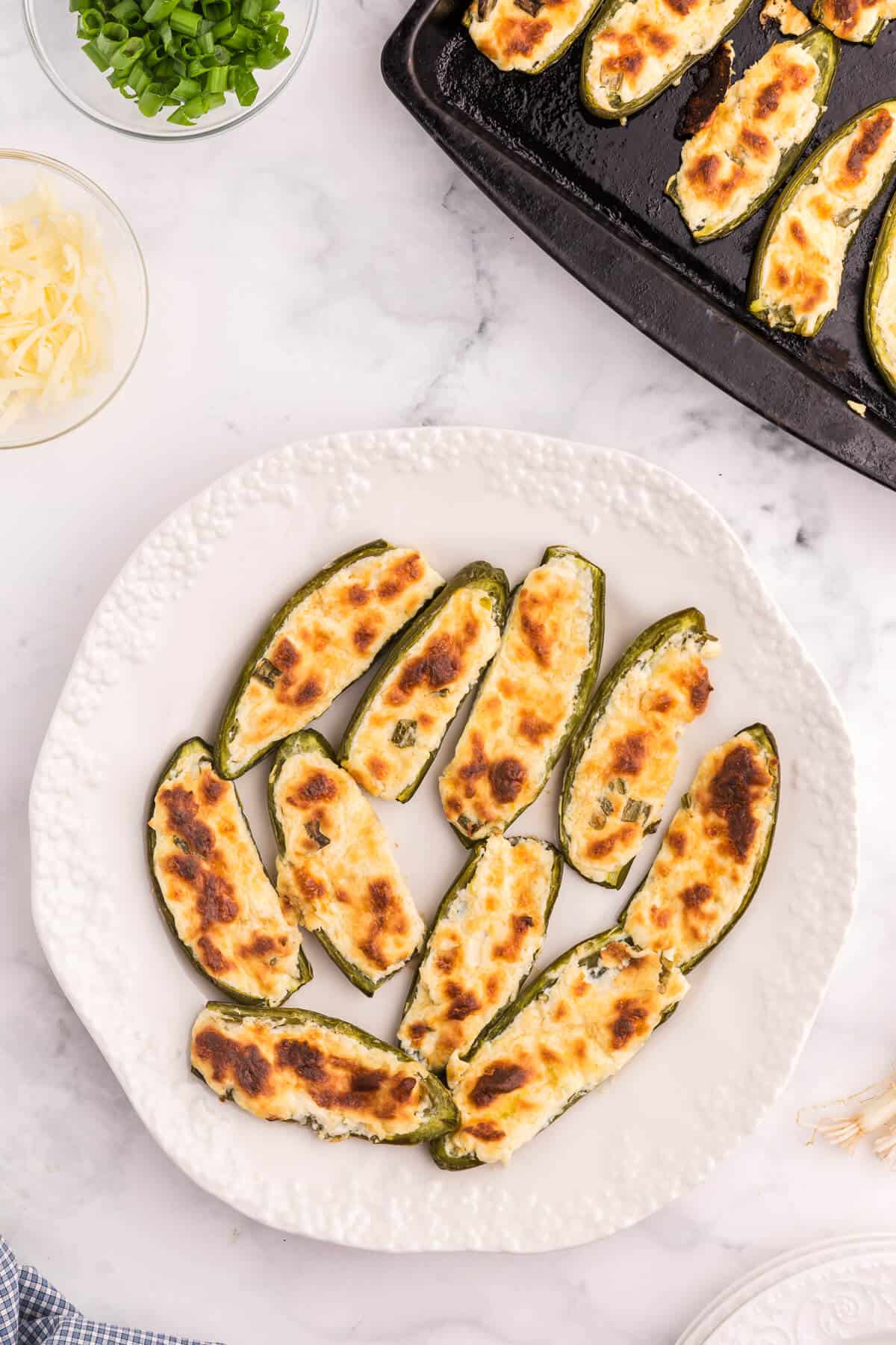 A plate of cheese stuffed jalapenos.