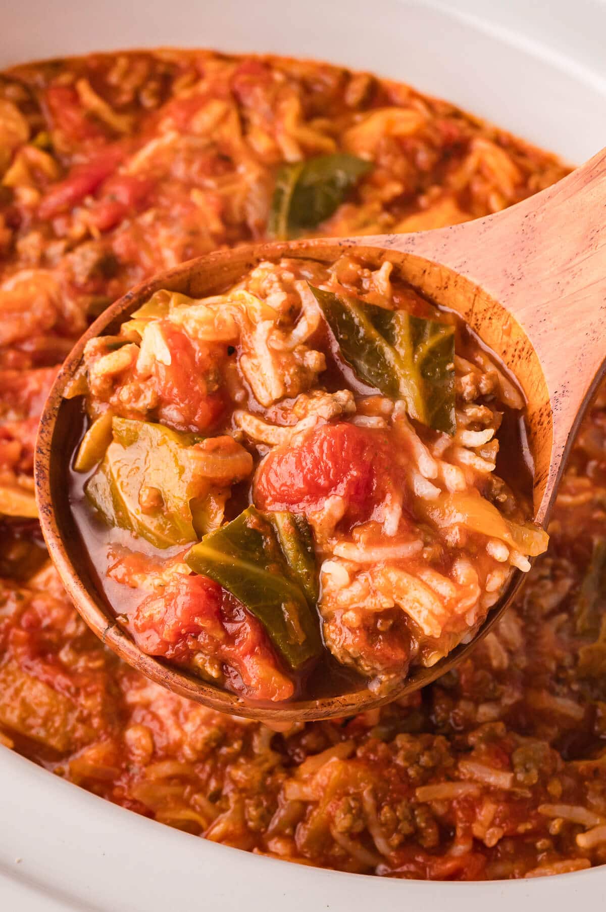 Soup on a wooden serving spoon.