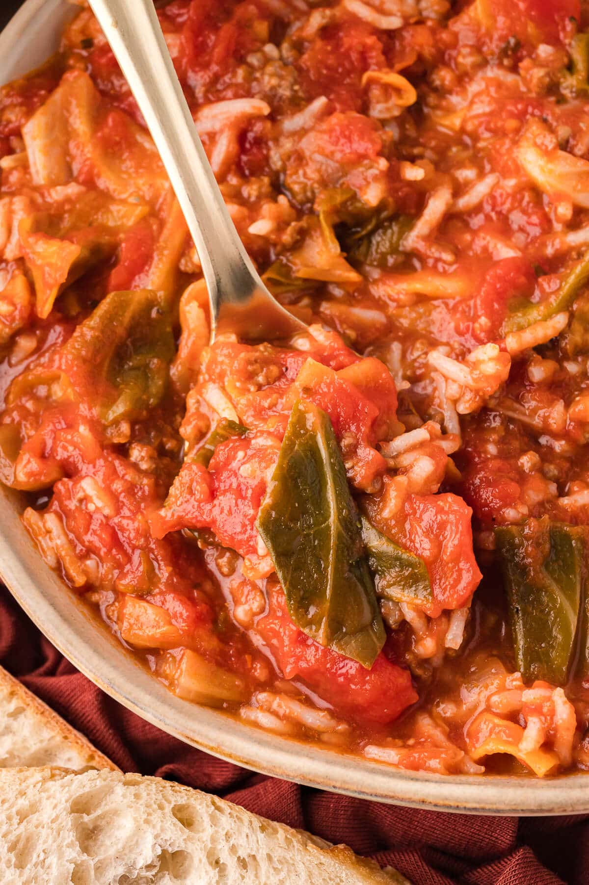 A bowl of soup with a spoon.