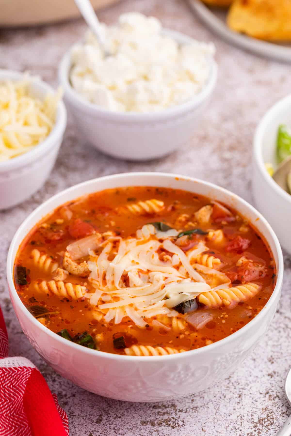 Lasagna soup in a white bowl.