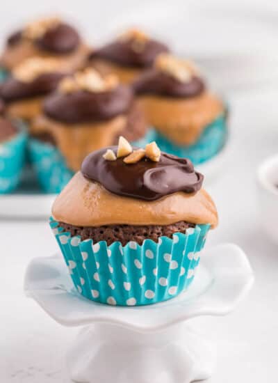 peanut butter brownie cupcake on a cupcake stand
