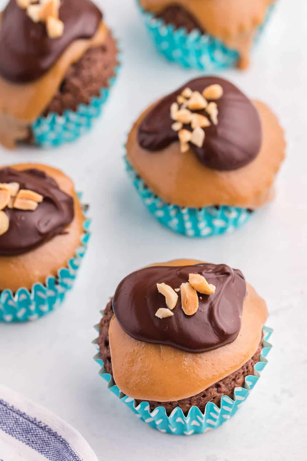 peanut butter brownie cupcakes on a white board