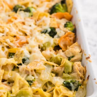 Santa Fe Chicken Tortellini Casserole - Creamy tortellini pasta with veggies topped with crunchy tortilla chips.