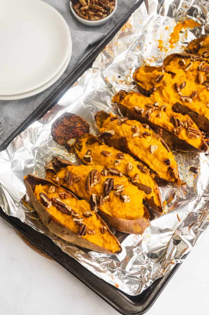 Twice Baked Sweet Potatoes - Creamy and rich made with maple syrup and cream cheese. Sweet and savory sweet potatoes are as decadent as the famous casserole, but easy enough for a weeknight dinner.