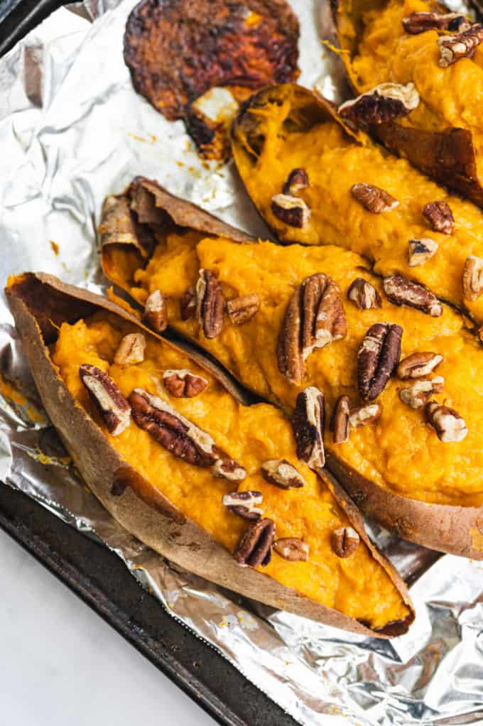 Twice Baked Sweet Potatoes - Creamy and rich made with maple syrup and cream cheese. Sweet and savory sweet potatoes are as decadent as the famous casserole, but easy enough for a weeknight dinner.